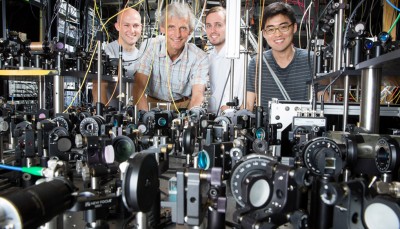 The Ketterle Group is working with lasers to create superfluids at MIT. Pictured, from left to right: grad student Colin Kenned, Professor Wolfgang Ketterle, grad student William Cody Burton, and grad student Woo Chang Chung. Photo: Bryce Vickmark